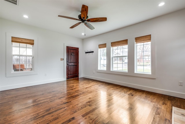 unfurnished room with ceiling fan and hardwood / wood-style floors