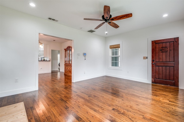 interior space featuring ceiling fan and dark hardwood / wood-style flooring