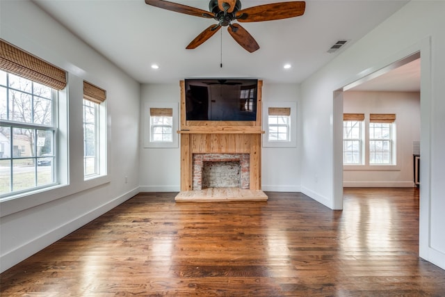 unfurnished living room with ceiling fan and dark hardwood / wood-style floors