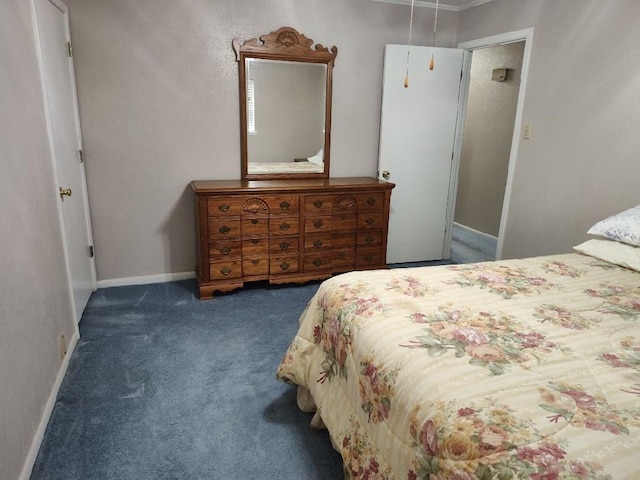 bedroom with dark colored carpet