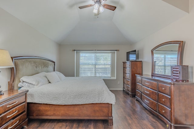 bedroom featuring ceiling fan, multiple windows, vaulted ceiling, and dark hardwood / wood-style floors