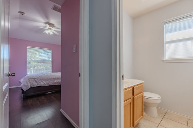 bathroom with vanity, ceiling fan, toilet, and wood-type flooring