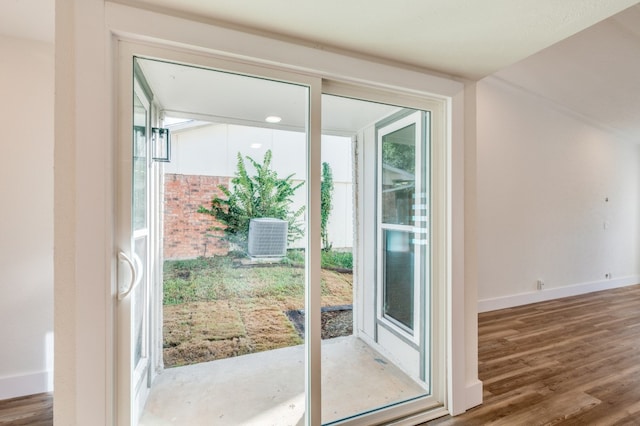 entryway with wood-type flooring