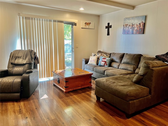 living room with hardwood / wood-style floors and beamed ceiling