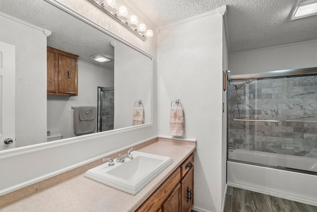 full bathroom with enclosed tub / shower combo, a textured ceiling, toilet, vanity, and hardwood / wood-style flooring