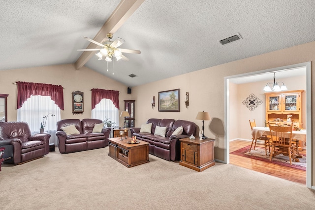 living room featuring light carpet, vaulted ceiling with beams, ceiling fan with notable chandelier, and a textured ceiling