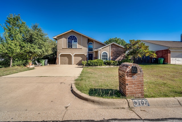 front of property with a garage and a front lawn