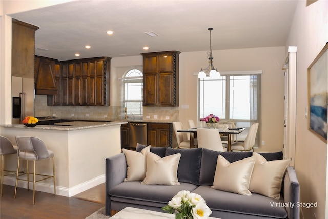 interior space featuring a notable chandelier and dark hardwood / wood-style floors