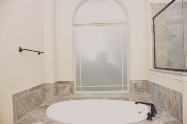 bathroom with separate shower and tub