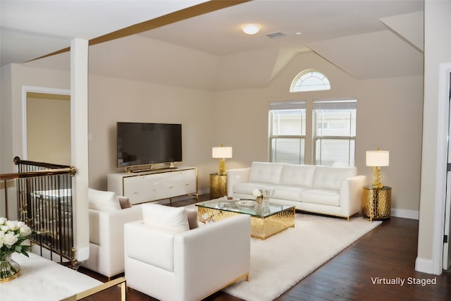 living room with dark wood-type flooring and vaulted ceiling