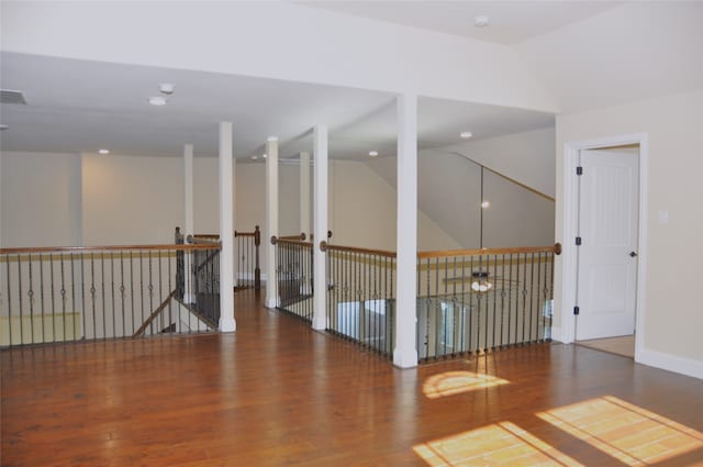 unfurnished room featuring wood-type flooring, ceiling fan, and lofted ceiling