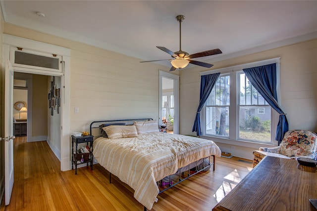 bedroom featuring light wood-type flooring and ceiling fan