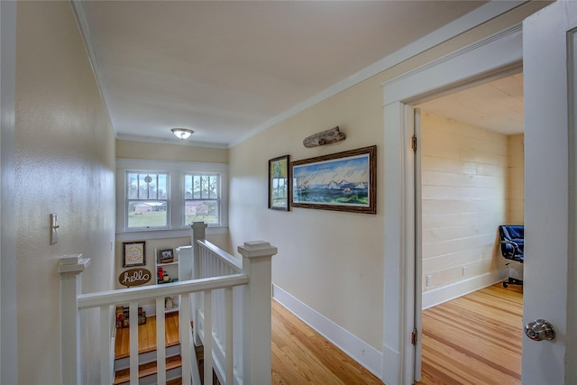 339 N 1st St, Point, TX 75472 - hallway with an upstairs landing, crown molding, wood finished floors, and baseboards