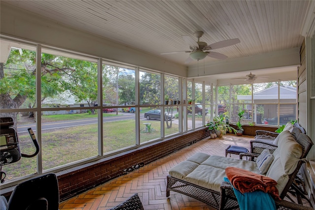 sunroom featuring plenty of natural light and ceiling fan