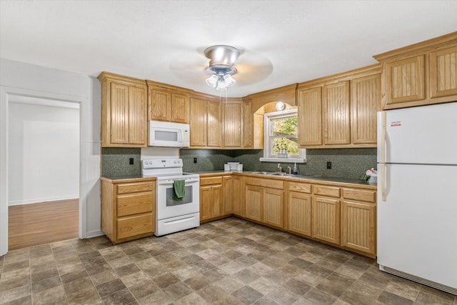 kitchen with white appliances, backsplash, ceiling fan, and sink