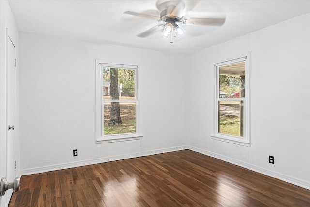 spare room featuring wood-type flooring and ceiling fan