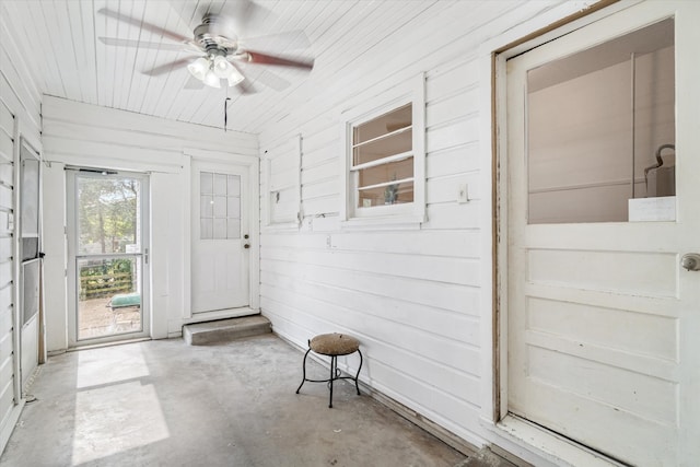 sunroom / solarium featuring ceiling fan