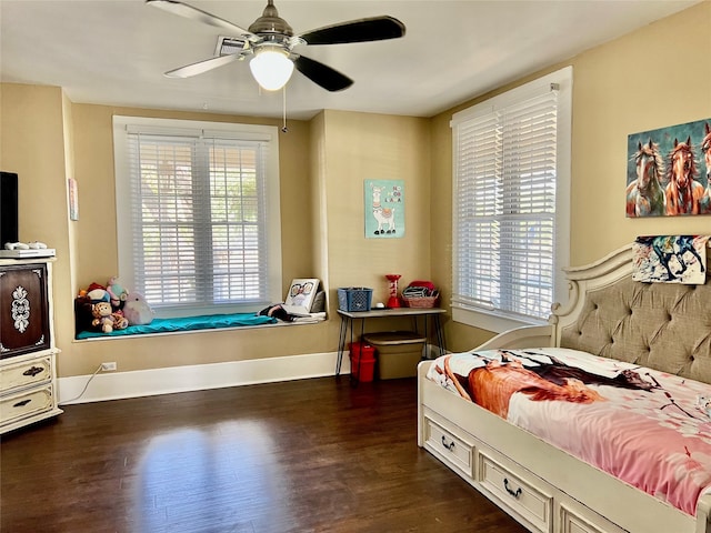 bedroom with ceiling fan and dark hardwood / wood-style floors