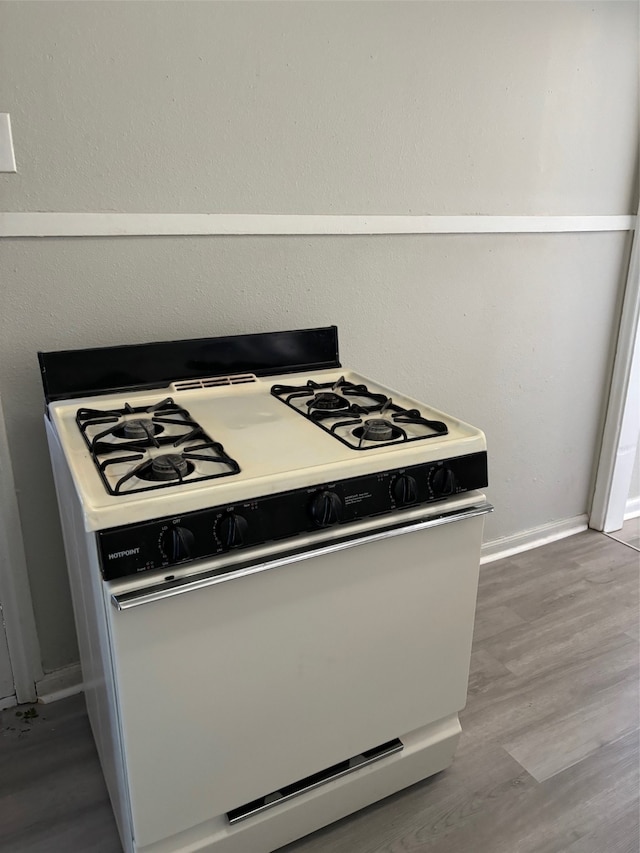 kitchen featuring white stove and light wood-type flooring