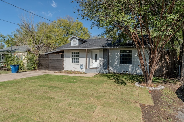 ranch-style home featuring a front yard