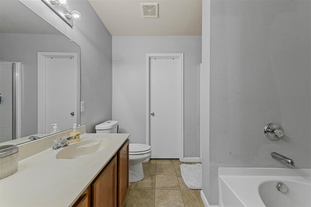 full bathroom featuring separate shower and tub, tile patterned flooring, vanity, and toilet