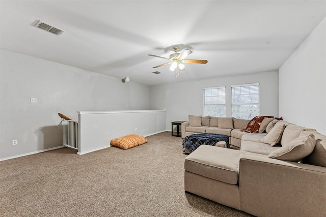 carpeted living room with ceiling fan