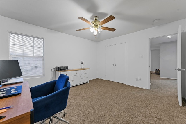 office area with light carpet and ceiling fan