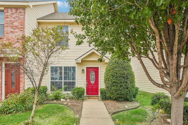 view of front of home with a shingled roof