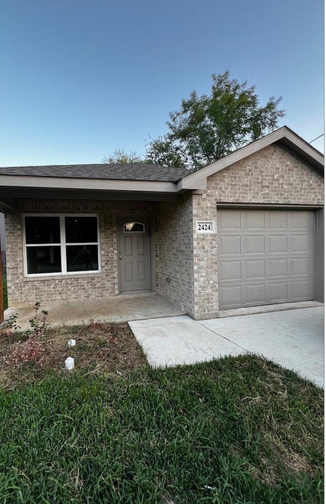 ranch-style home featuring a garage