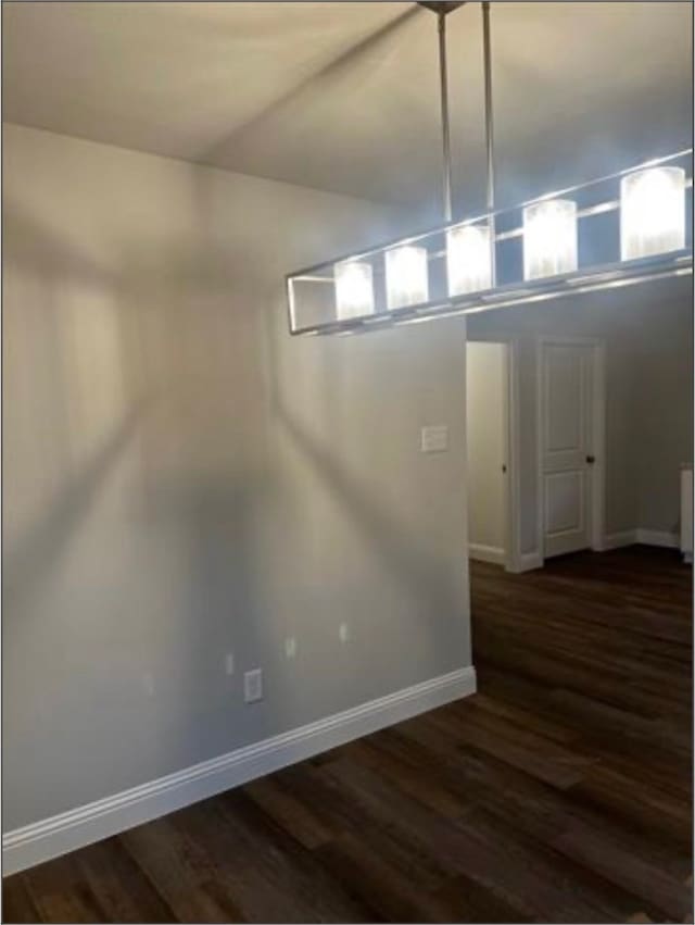 basement with dark wood-type flooring