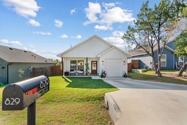 modern inspired farmhouse featuring a garage and a front lawn