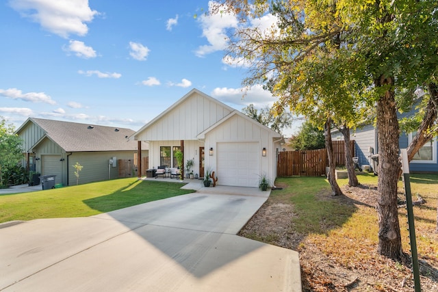 modern inspired farmhouse with a garage and a front lawn