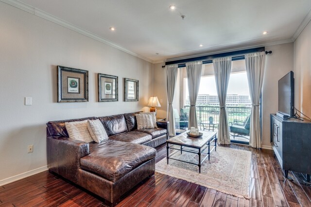 living room with ornamental molding and dark hardwood / wood-style floors