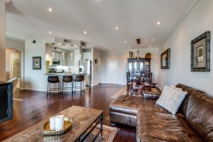 living room with dark hardwood / wood-style flooring and crown molding