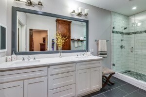 bathroom with vanity, tile patterned floors, and a shower with shower door