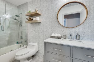 full bathroom with vanity, combined bath / shower with glass door, and toilet