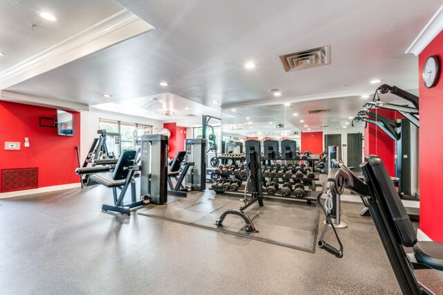 gym with ornamental molding