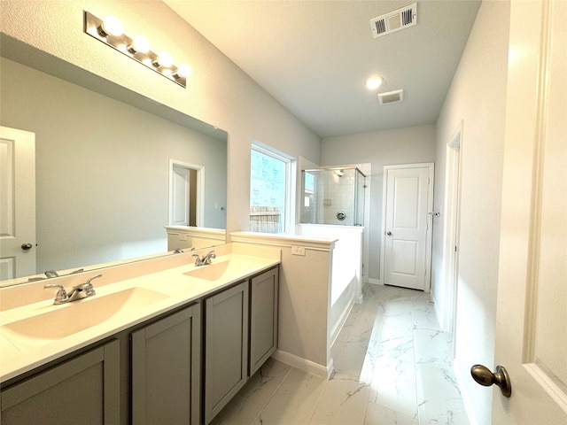 bathroom featuring shower with separate bathtub and vanity