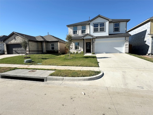 front of property with a front yard and a garage