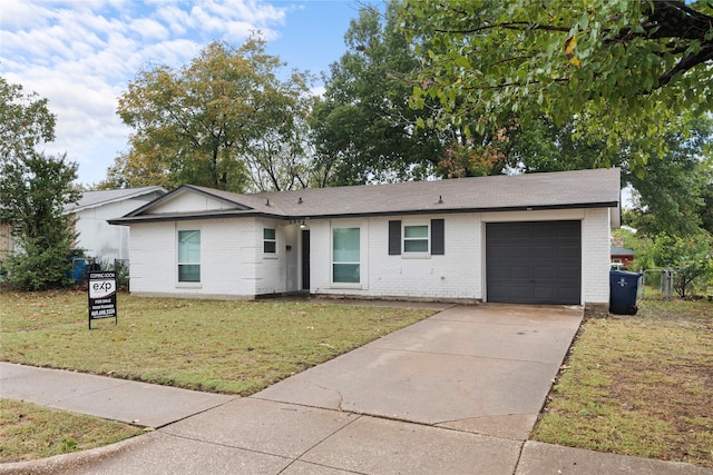 ranch-style home with a garage and a front lawn