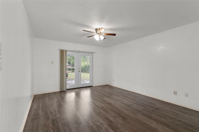 empty room featuring a textured ceiling, french doors, dark hardwood / wood-style flooring, and ceiling fan