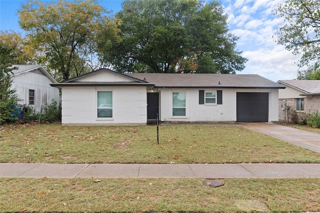 ranch-style house with a front lawn and a garage