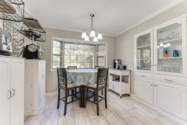 dining room featuring crown molding and an inviting chandelier