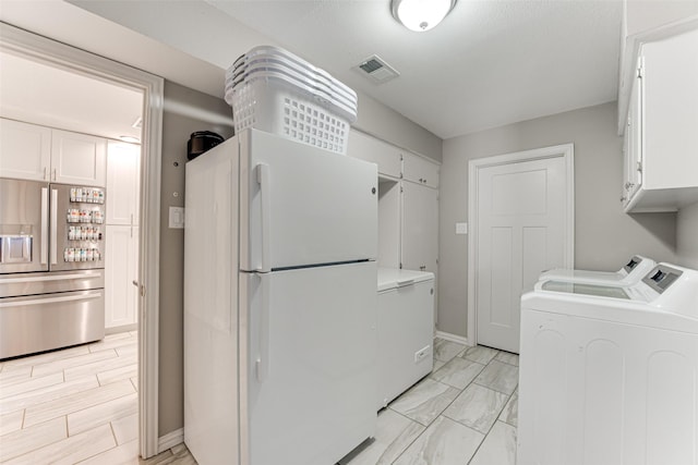 1401 Crescent Dr, Sherman, TX 75092 - laundry room with washer and dryer, cabinet space, light marble finish floors, and baseboards