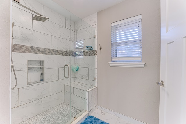 bathroom featuring an enclosed shower