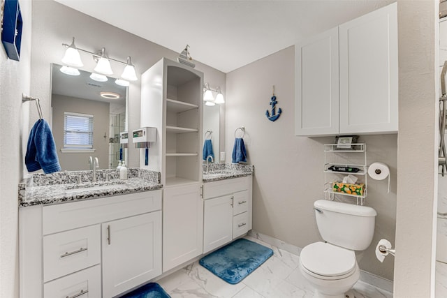 1401 Crescent Dr, Sherman, TX 75092 - bathroom with toilet, marble look tile flooring, vanity, and baseboards