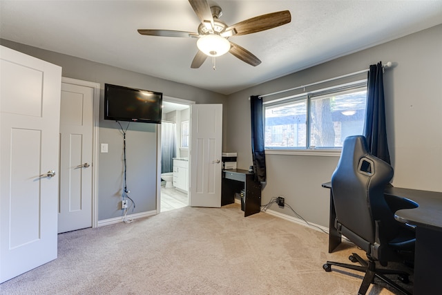 home office with ceiling fan and light colored carpet