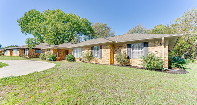 ranch-style house with a front lawn