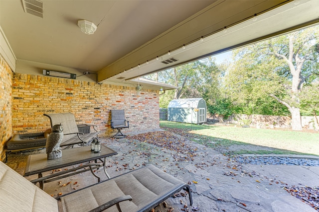 view of patio / terrace with a shed