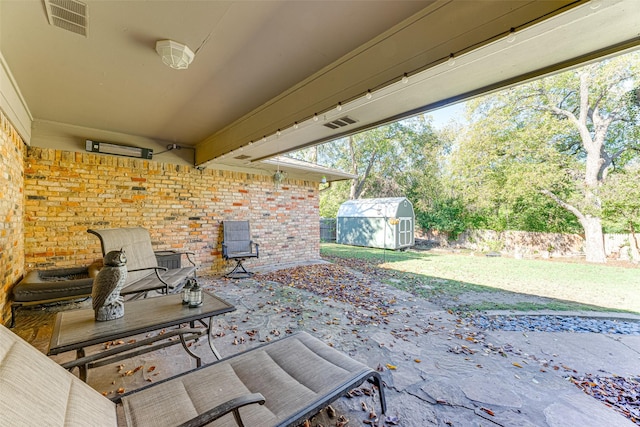 1401 Crescent Dr, Sherman, TX 75092 - view of patio featuring a storage unit, an outbuilding, and fence
